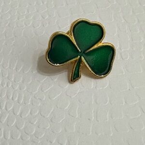 Clover pin.